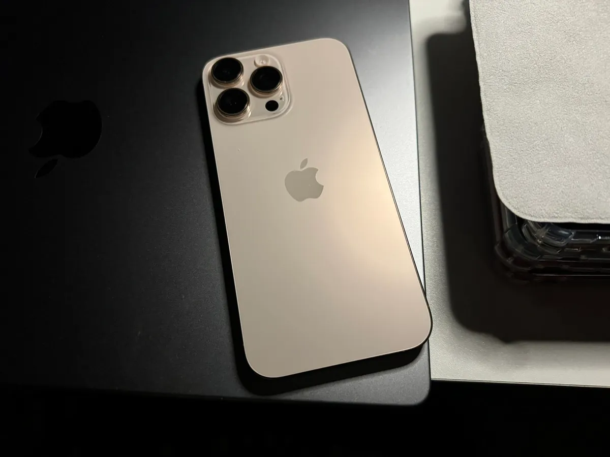 Back of an iPhone 16 Pro Max in Desert Titanium