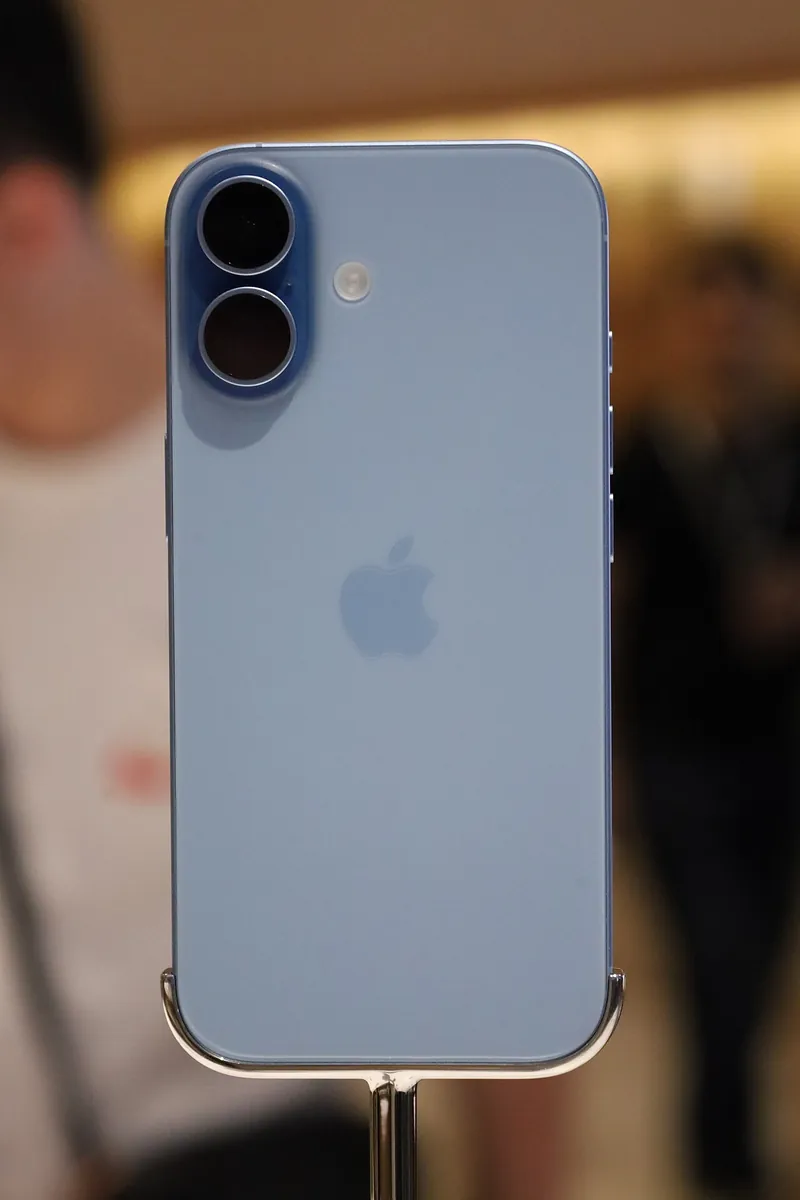 Back of an iPhone 17 in Mist Blue